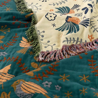 Wendbare Tagesdecke mit Vogel- und Blumenmotiv